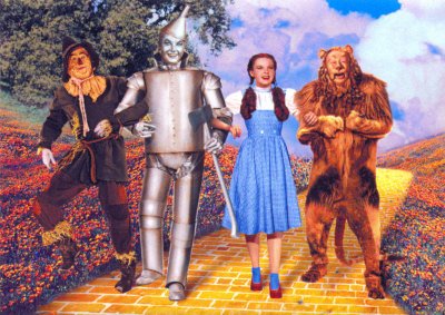 Scarecrow (Ray Bolger), Tin Man (Jack Haley), Dorothy Gale (Judy Garland) and Cowardly Lion (Bert Lahr),